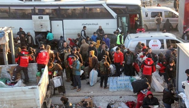 Syrians, who were evacuated from the last rebel-held pockets of Aleppo, arrive in the opposition-controlled Khan al-Assal region.