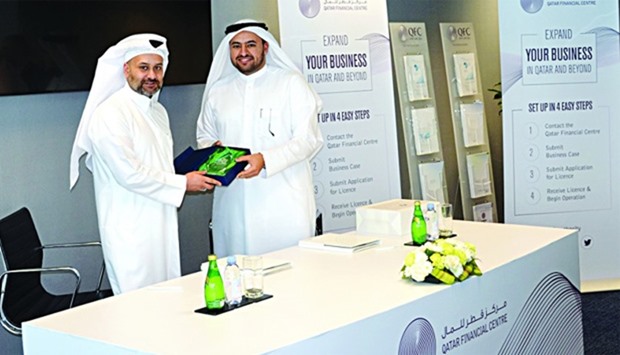 Al-Jaida (left) with al-Khulaifi during the agreement signing between Qatar Financial Centre Authority and Qatar Universityu2019s College of Law.