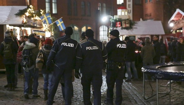 German police guard  a Christmas market in Berlin following an attack last month.