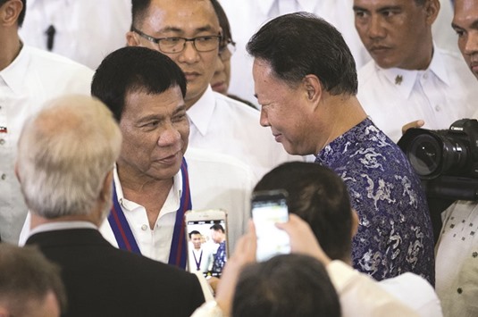 File photo shows President Rodrigo Duterte talking to Chinese ambassador to the Philippines Zhao Jianhua during the 115th Police Service Anniversary at the Philippine National Police (PNP) headquarters in Manila.