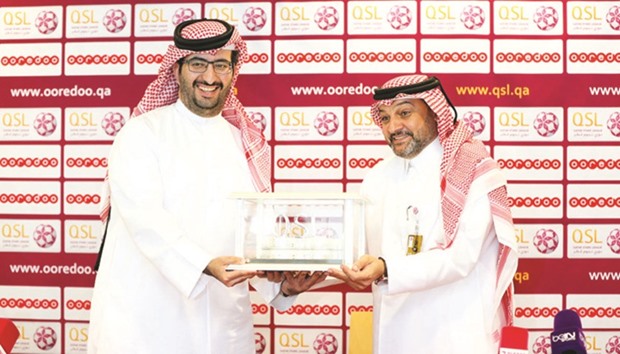 Sheikh Ali Bin Jabor al-Thani, Chief Legal and Regulatory Officer of Ooredoo Qatar (left) and Hani Ballan, Chief Executive Officer of the Qatar Stars League.