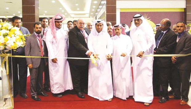 Al Meera chairman Sheikh Thani bin Thamer bin Mohamed al-Thani cuts a ribbon to inaugurate the new branch in North Sailiya (Al Miarad).