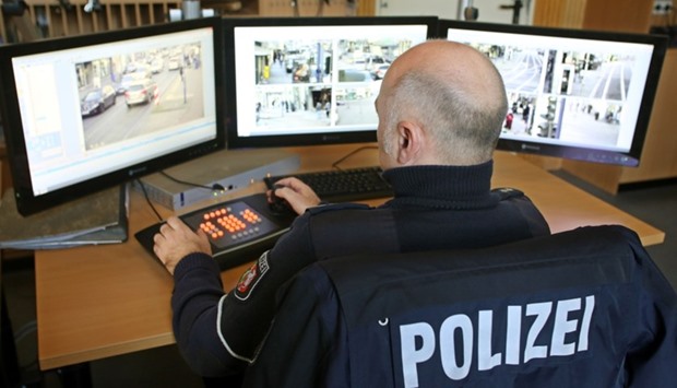 A policeman watches monitors displaying images delivered by surveillance cameras in the Marxloh district of Duisburg, western Germany.