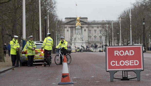 Police close The Mall by Buckingham Palace in central London before the Changing of the Guard ceremony.