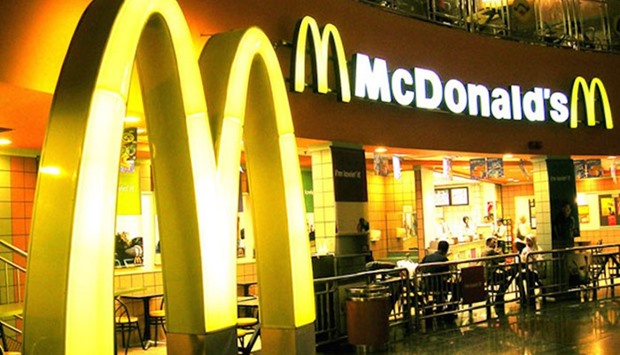 European groups say that consumers are charged more at franchises than at McDonald's own stores.