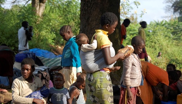 South Sudanese refugees are pictured in the open near their shelter in the Congolese village of Karukwat.