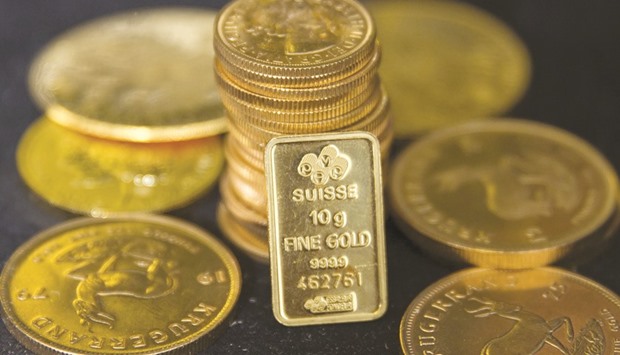 Oversea-Chinese Banking Corp and ABN Amro Group see gold sliding to $1,100 an ounce by the end of next year as the Federal Reserve tightens monetary policy, real Treasury yields increase and the US currency rises