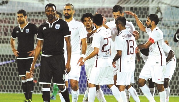 El Jaish players celebrate scoring the equaliser against Al Sadd during their key Qatar Stars League match yesterday.