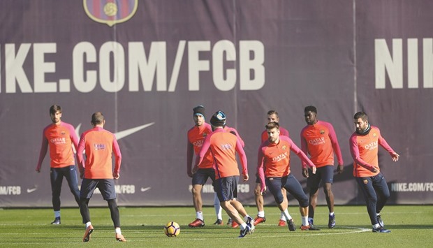 Barcelona players take part in a training session on the eve of their Spanish League El Clasico match against arch-rivals Real Madrid at Camp Nou. (AFP)