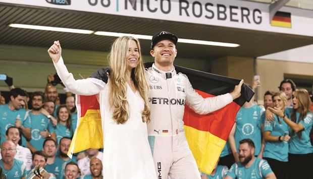 File picture of Mercedesu2019 Formula One driver Nico Rosberg of Germany celebrating with his wife, Vivian Sibold, after winning the Formula One world championship.