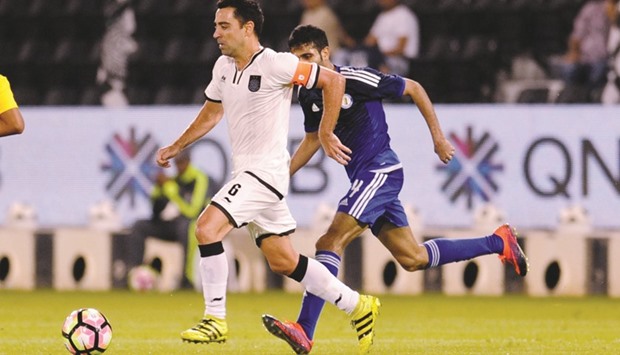 Al Sadd captain Xavi (left) in action against Al Khor yesterday.