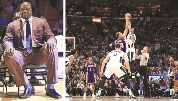 Miami Heat legend Shaquille Ou2019Neal (left photo) watches from the sidelines as Timofey Mozgov (right photo,tip off left) of the Los Angeles Lakers fights for the ball with Hassan Whiteside of Miami during their NBA game at the American Airlines Center in Miami, Florida, yesterday. Heat rallied from a 19-point second-quarter deficit to beat Ou2019Nealu2019s former team Lakers 115-107 and snap a three-game losing skid. (AFP)
