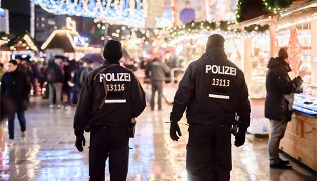 Police patrolling the reopened Christmas market in Berlin on Thursday.
