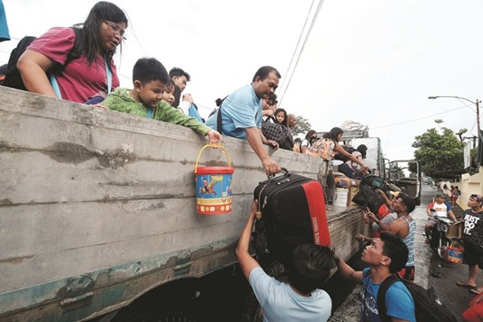 Stranded passengers from Tabaco port are evacuated by the local government in Tabaco City, Albay province, yesterday after their seafaring vessels were prohibited from sailing ahead of typhoon Nock-Tenu2019s expected arrival.