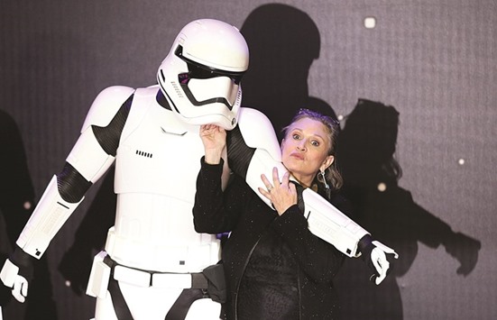 Fisher posing for the cameras on her arrival at the European premiere of Star Wars: The Force Awakens in Londonu2019s Leicester Square on December 16 last year.