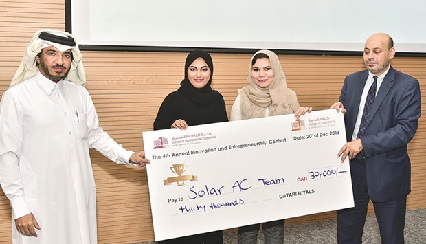 First place winners of the competition with QU officials.