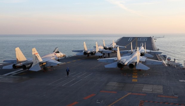 Chinese J-15 fighter jets on the deck of the Liaoning aircraft carrier during military drills