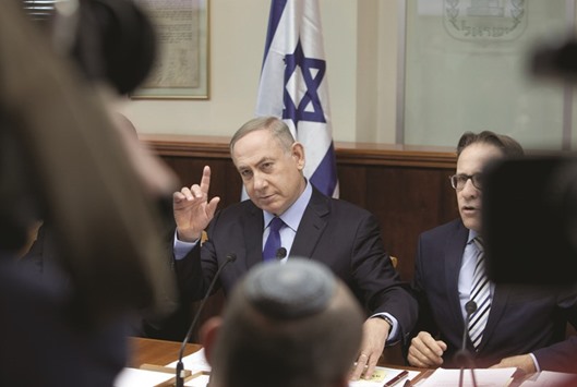Israeli Prime Minister Benjamin Netanyahu speaks at the weekly cabinet meeting at his Jerusalem office yesterday.