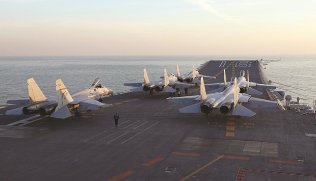 Chinese J-15 fighter jets on the deck of the Liaoning aircraft carrier during military drills earlier this month in the Bohai Sea, off Chinau2019s northeast coast. Chinau2019s navy plans a training exercise in the Pacific that would include for the first time its sole aircraft carrier, a move likely to ratchet up regional tensions.