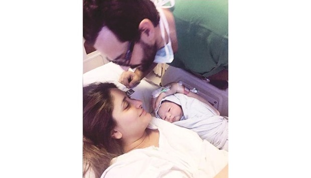 SO MUCH ADO: Saif and Kareena with their newborn.