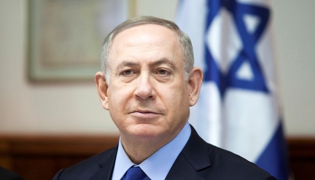 Israeli Prime Minister Benjamin Netanyahu attends the weekly cabinet meeting at his Jerusalem office yesterday