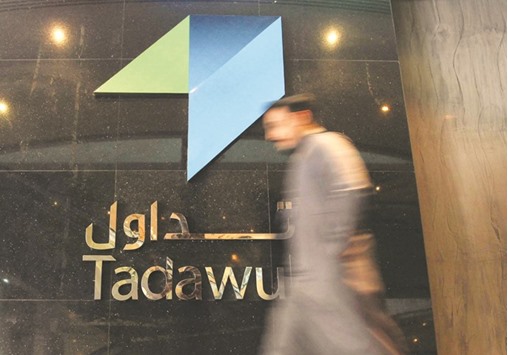 An investor walks at the Saudi Stock Exchange (Tadawul) in Riyadh. The Saudi index added 1.5% on Sunday in reaction to Riyadhu2019s modestly expansionary state budget for 2017.