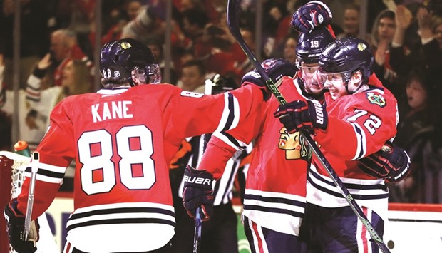 (L to R) Patrick Kane Jonathan Toews and Artemi Panarin of the Chicago Blackhawks celebrate Toewsu2019 goal in the second period against the Colorado Avalanche at the United Center in Chicago, Illinois, on Friday. (Getty Images/AFP)