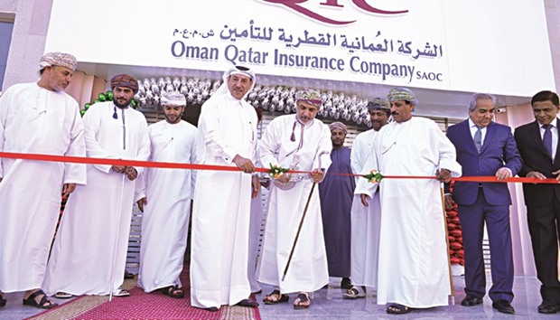 Officials and dignitaries at the ribbon-cutting ceremony for OQICu2019s new branch in Salalah, Oman.