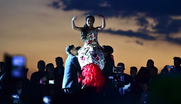 Rubi Ibarra (C)dances during her 15th birthday celebrations in Villa Guadalupe