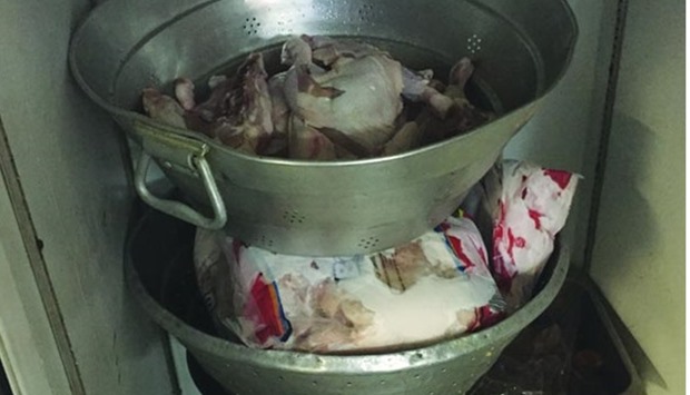 Chicken being thawed in unhygienic conditions at an eatery that was penalised.