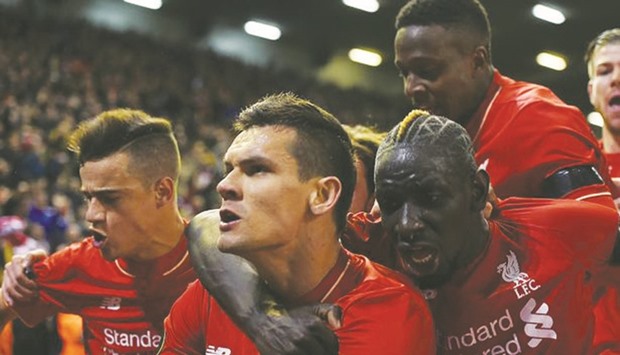 Dejan Lovren of Liverpool celebrates in front of the Kop after scoring the winning goal in the Europa League quarter-final on a thrilling night at Anfield.