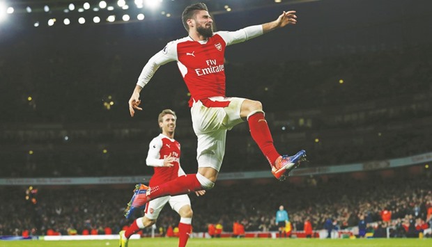 Arsenalu2019s French striker Olivier Giroud celebrates after scoring the winner against West Bromwich Albion at the Emirates Stadium in London on Monday. (AFP)