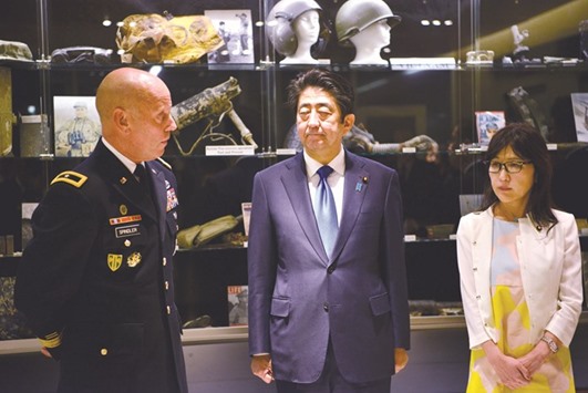 US Army Brigadier General Spindler, left, is seen with Japanese Prime Minister Shinzo Abe, centre, and Japanese Defence Minister Tomomi Inada in Honolulu, Hawaii.