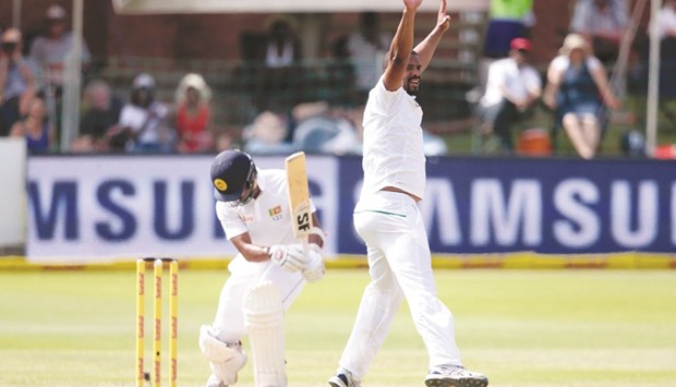South Africau2019s bowler Vernon Philander (right) celebrates the dismissal of Sri Lankau2019s Dinesh Chandimal on second day of the first Test in Port Elizabeth, South Africa, yesterday. (AFP)
