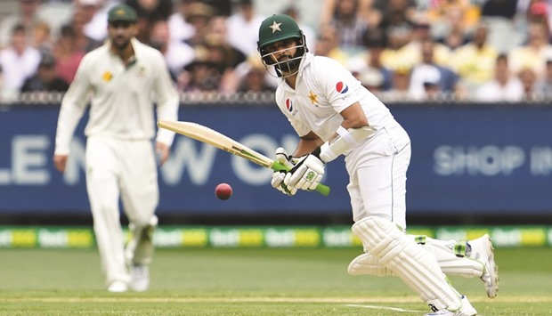 Pakistanu2019s Azhar Ali (right) steers the ball away for runs on the second day of the second Test in Melbourne yesterday. (AFP)