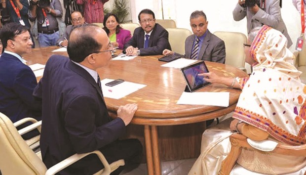 Sheikh Hasina at the launch ceremony of u2018BMD Weather Appu2019 at her office in Dhaka yesterday.
