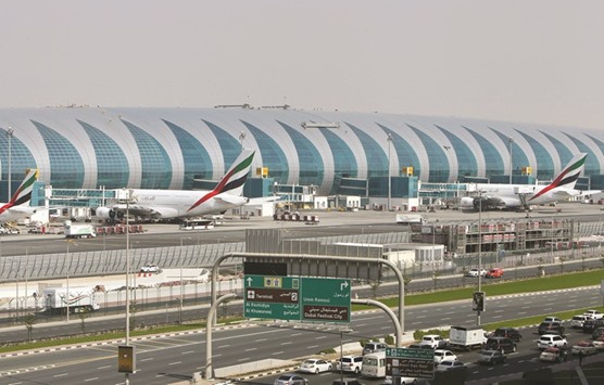 Airbus A380 aircraft owned by Emirates parked at Concourse A of Terminal 3 at the Dubai International Airport (file). Airbus Groupu2019s struggles with its A380  superjumbo are deepening as the plane maker delays deliveries of a dozen aircraft over the next two years to Emirates, the double-deckeru2019s biggest customer.