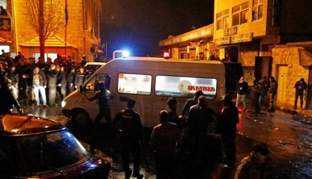 Police and ambulances gathered in Karak amid a stand-off with the gunmen during the December 18  attack.
