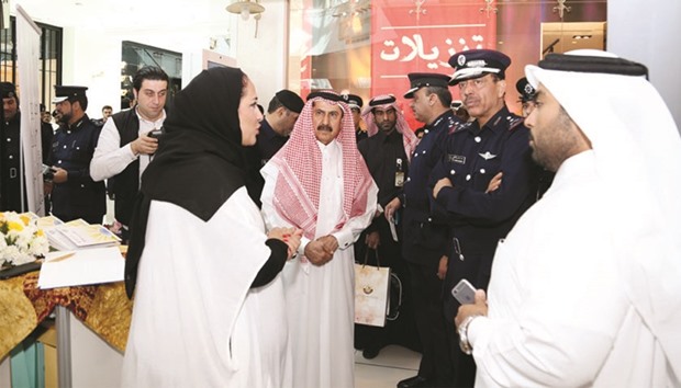 Director General of Public Security Major General Saad bin Jassim al-Khulaifi visits QRCSu2019 corner as Secretary-General Ali bin Hassan al-Hammadi looks on.