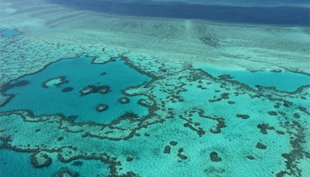An aerial view of the Great Barrier Reef off the coast of the Whitsunday Islands, along the central coast of Queensland.