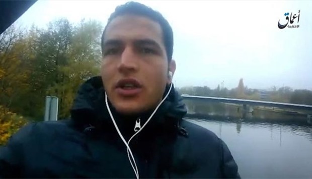 This file image grab taken on December 23 from a propaganda video shows suspected jihadist Berlin truck attacker Anis Amri pledging allegiance to the IS.