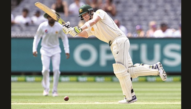 Australian batsman Steve Smith plays a shot en route to his 17th century during the second Test against Pakistan in Melbourne yesterday. (AFP)