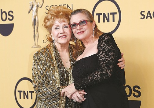Reynolds with her daughter Carrie Fisher backstage after accepting her Lifetime Achievement award at the 21st annual Screen Actors Guild Awards in Los Angeles on January 25, 2015.