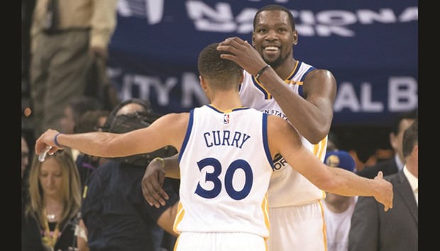Golden State Warriors forward Kevin Durant hugs guard Stephen Curry after the game against the Toronto Raptors at Oracle Arena. PICTURE: USA TODAY Sports