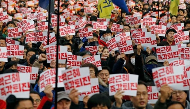 Members of Korean Confederation of Trade Unions chant slogans during a general strike calling for South Korean President Park Geun-hye to step down, in central Seoul on Wednesday.