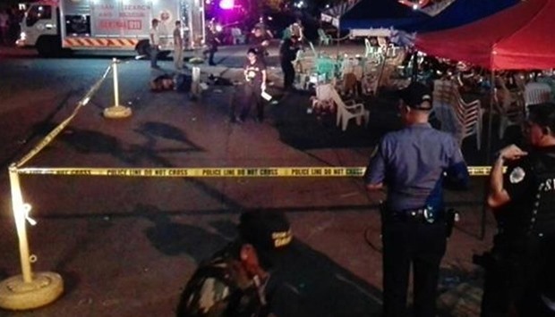 Police and medics at the scene of the attack