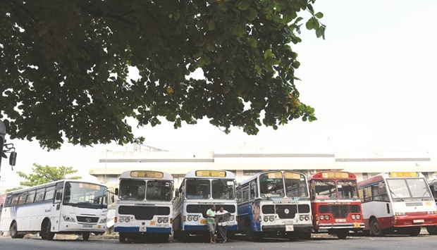 Sri Lankan private buses are parked at a bus terminal in the suburb of Nugegoda in Colombo yesterday. Sri Lankau2019s private bus operators and taxi drivers stopped work yesterday, to protest government plans of a 50-fold increase in traffic fines to curb the rising number of road accidents.