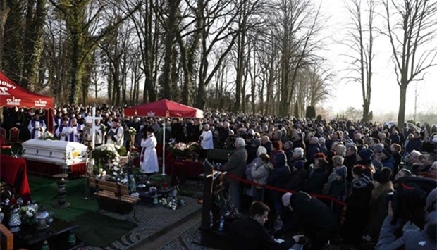 Mourners stand around the coffin of Lukasz Urban, the Polish truck driver who was killed in the Berlin Christmas market attack, during his funeral in Banie near Sczczecin, Poland, on Friday.