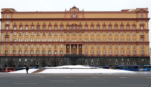 A man walks past the headquarters of the FSB security service, the successor to the KGB, in central Moscow on Friday.  President Vladimir Putin said on Friday that Moscow would not expel any US diplomats.