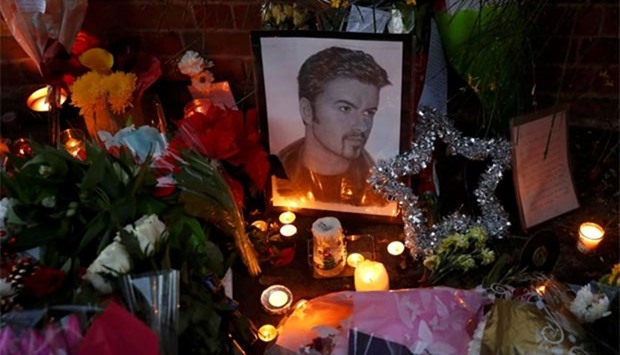 Tributes are seen outside the house of singer George Michael, where he died on Christmas Day, in Goring, southern England, on Monday.